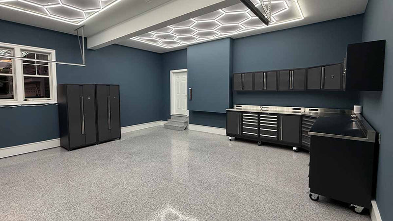 Dragonfire garage storage solutions in a garage with epoxy flooring and LED honeycomb lighting.